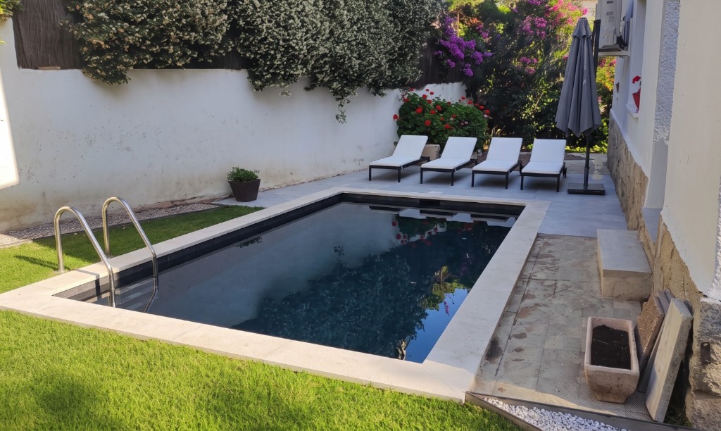 The same patio with a rectangular pool, stone coping and loungers, generated with Mix&Design