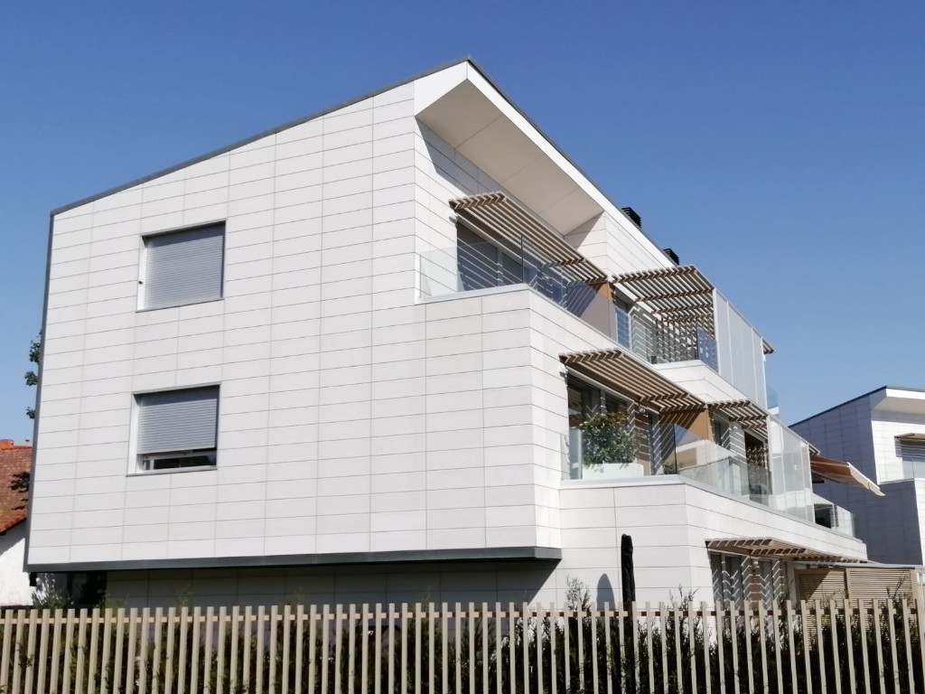 Contemporary building with a white tiled facade, starting photo for Mix&Design change materials