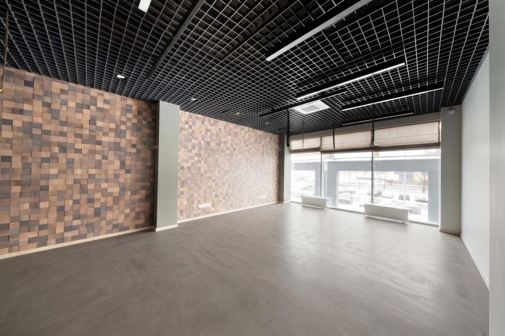 The same shop with a continuous grey microcement floor, generated with Mix&Design